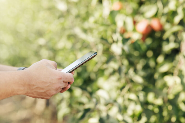 young-businessman-with-device-works-on-eco-farm-an-2026-03-24-02-21-23-utc